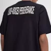 Avslappnad herr-T-shirt med tryck och lappar Avslappnad herr-T-shirt med tryck och lappar