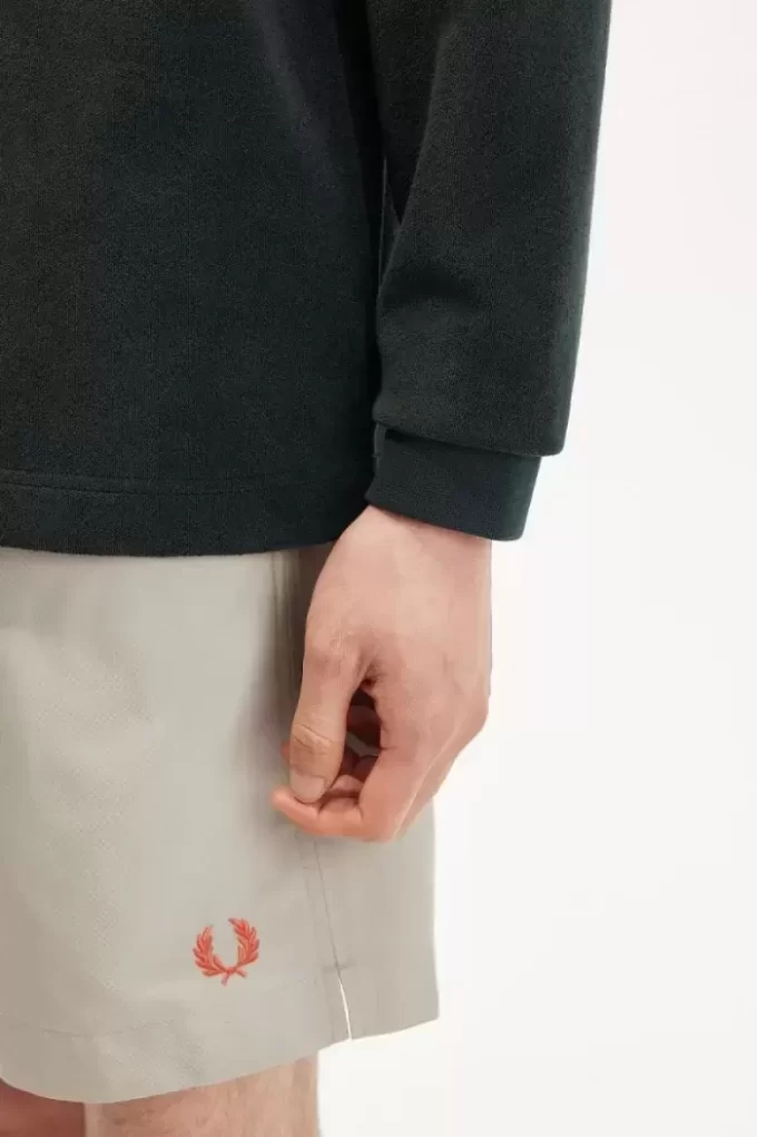 Avslappnad herrpolo i frotté Avslappnad herrpolo i frotté